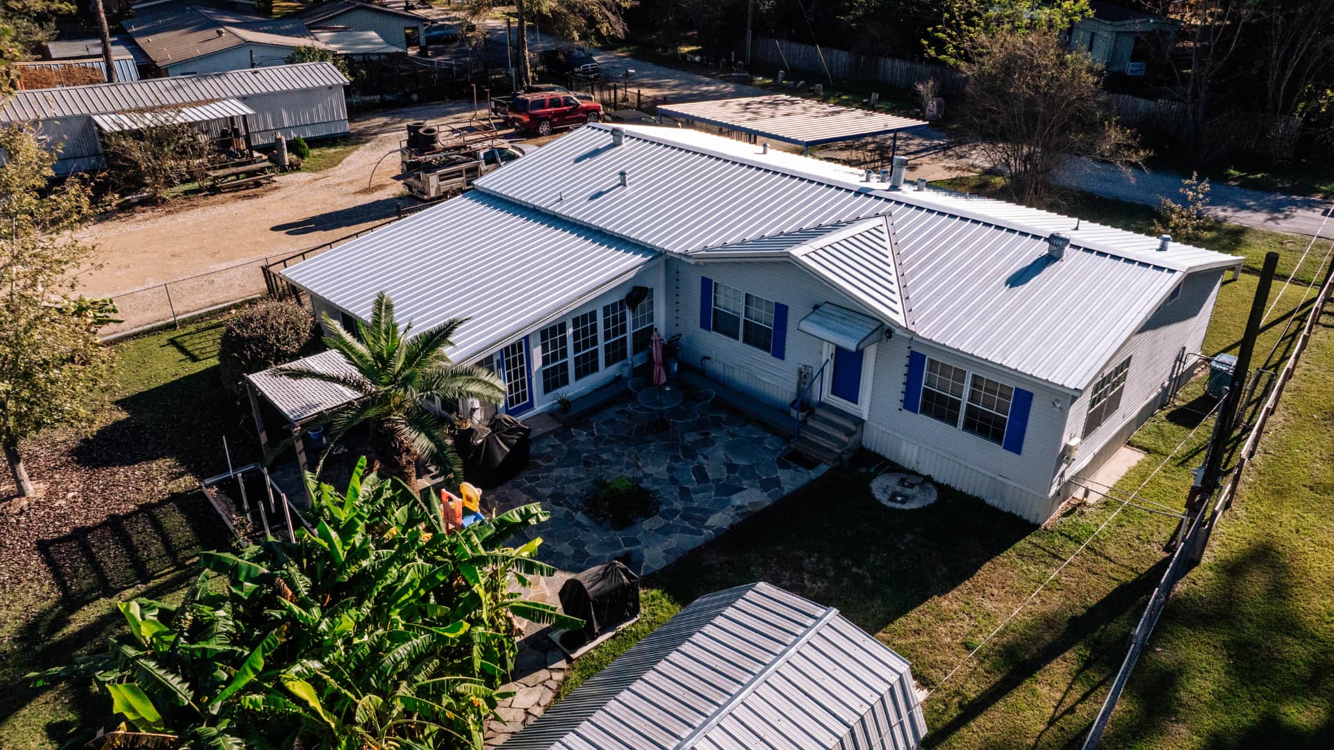 White standing seam metal roof on a Houston area home