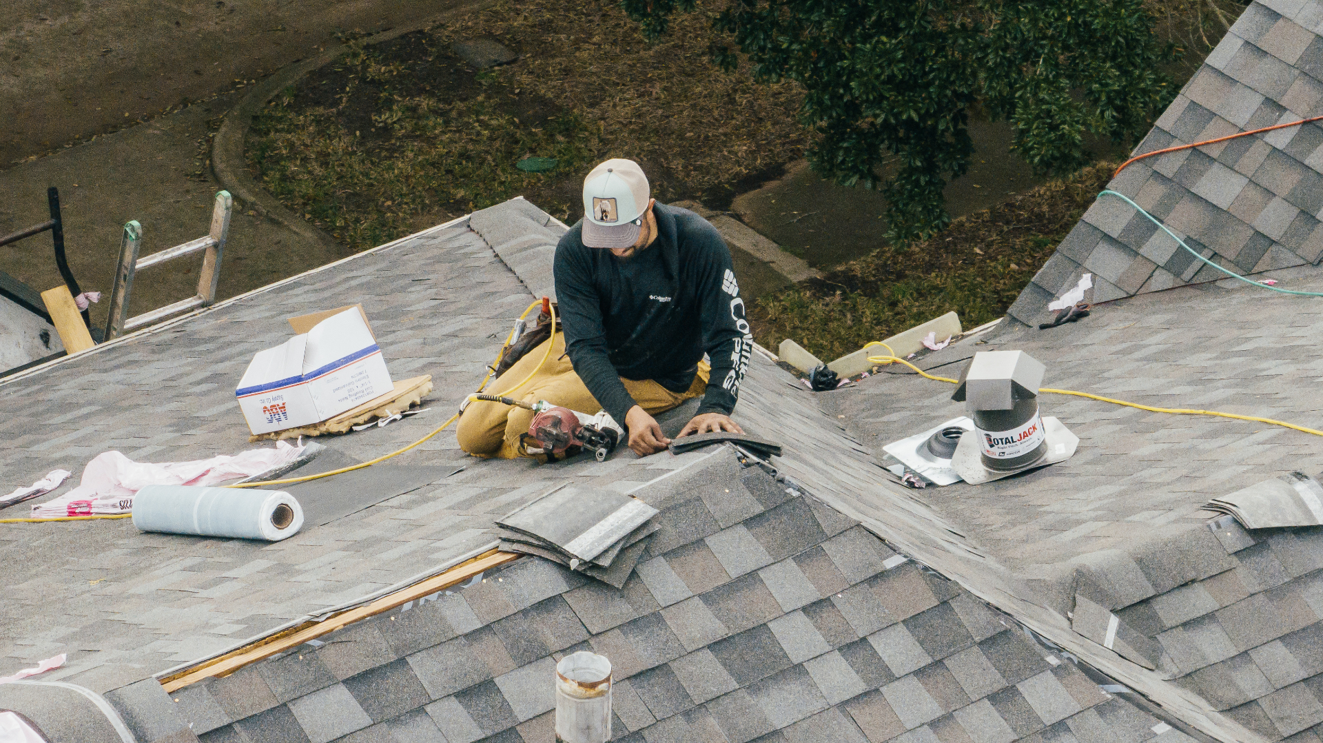 Invictus craftsman installing shingles on a Houston roof