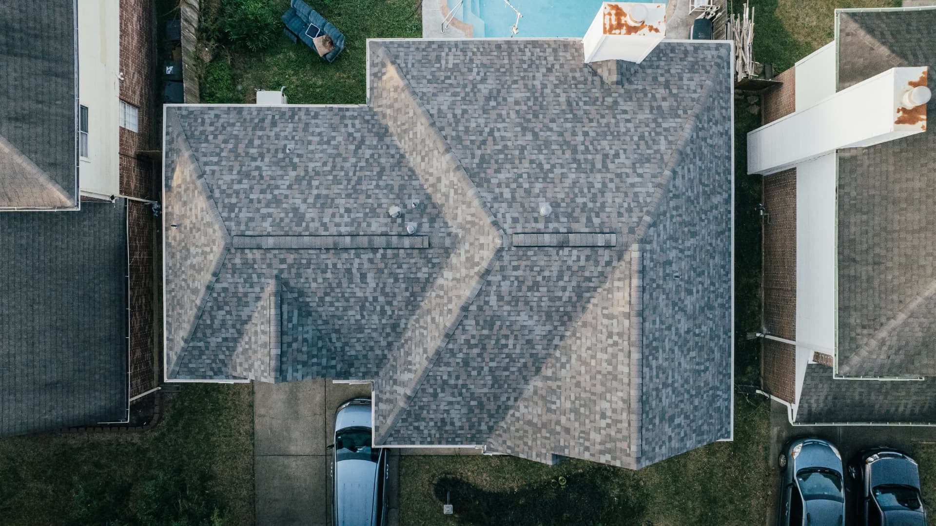 Top-down drone view of an architectural shingle roof checked during a Houston storm season survey