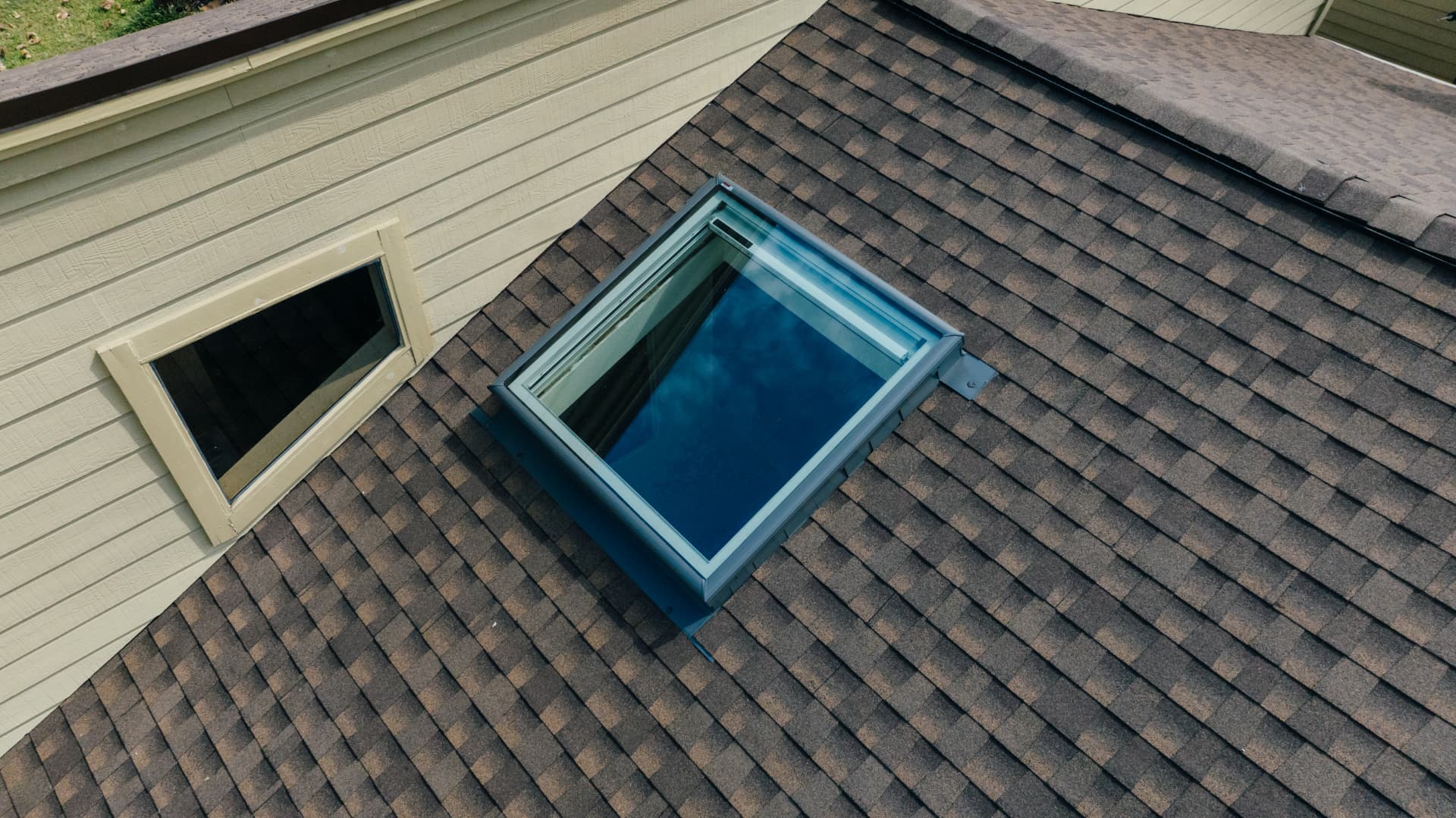 New skylight and flashing installed on a Houston shingle roof